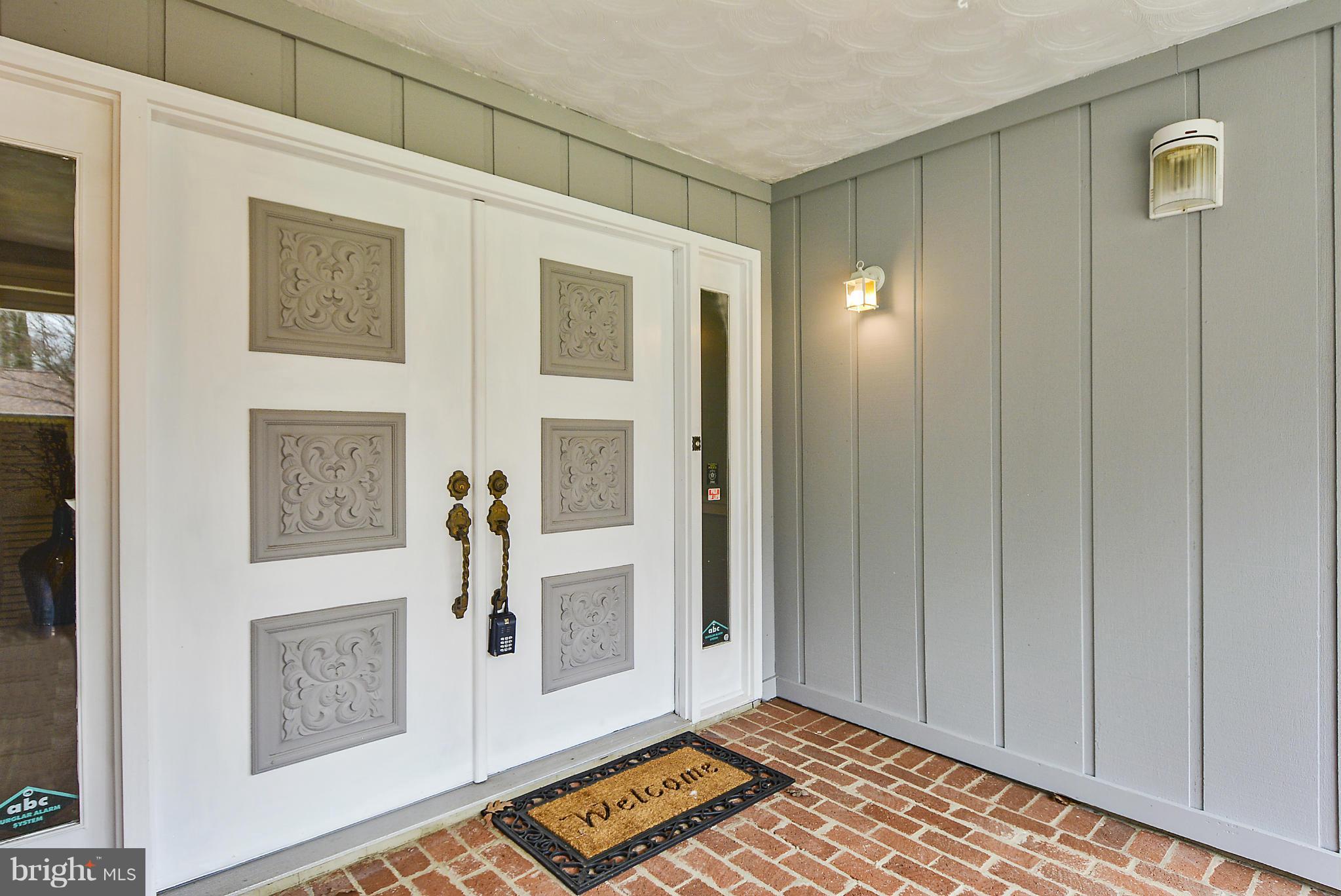 13318 Santa Anita Road Laurel, MD 20708 - Photo 20 of 29 Covered front porch with brick walkway