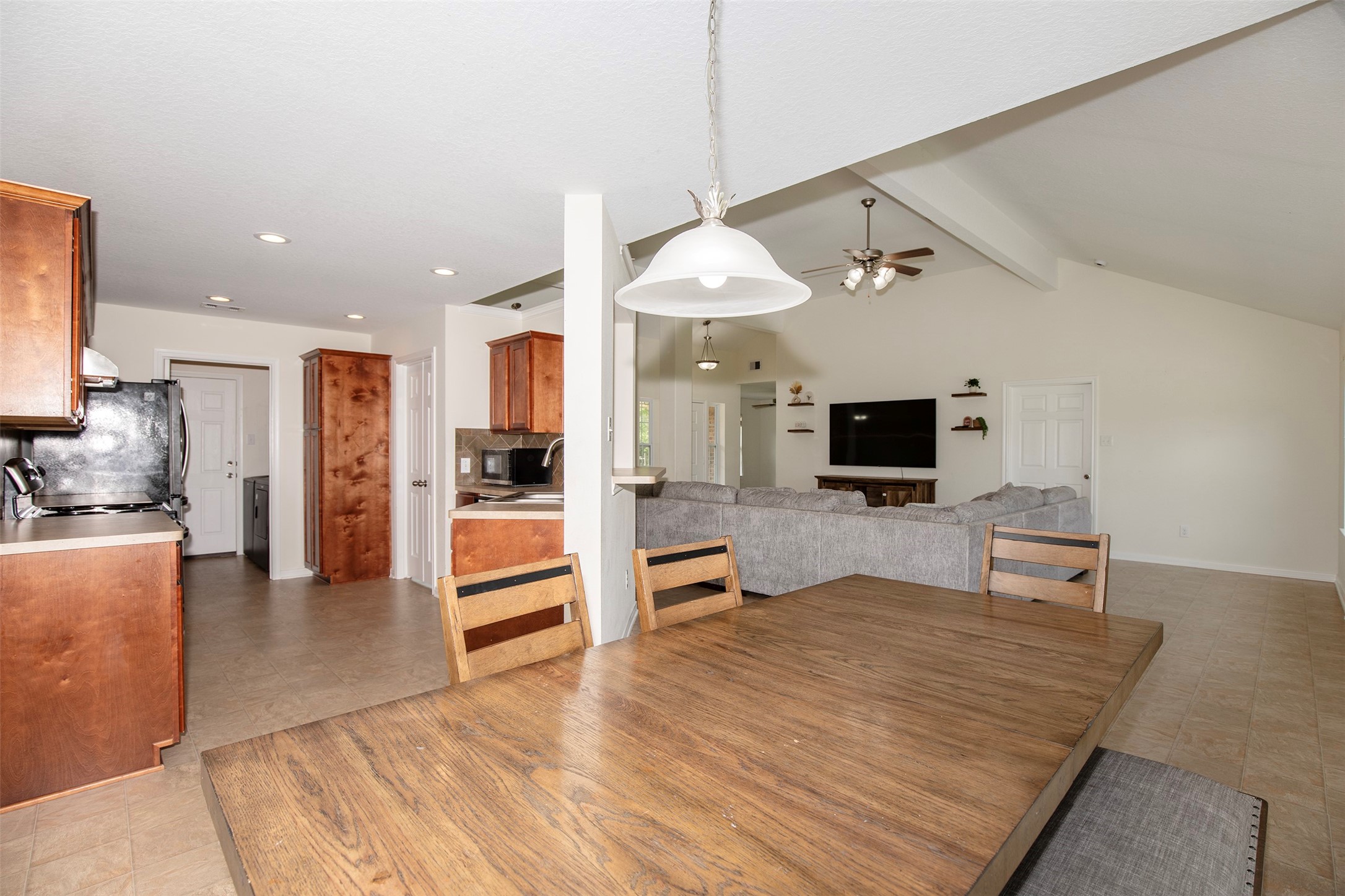 6105 Del Bello Boulevard Manvel, TX 77578 - Photo 17 of 37 a room with stainless steel appliances kitchen island granite countertop a refrigerator and a stove top oven