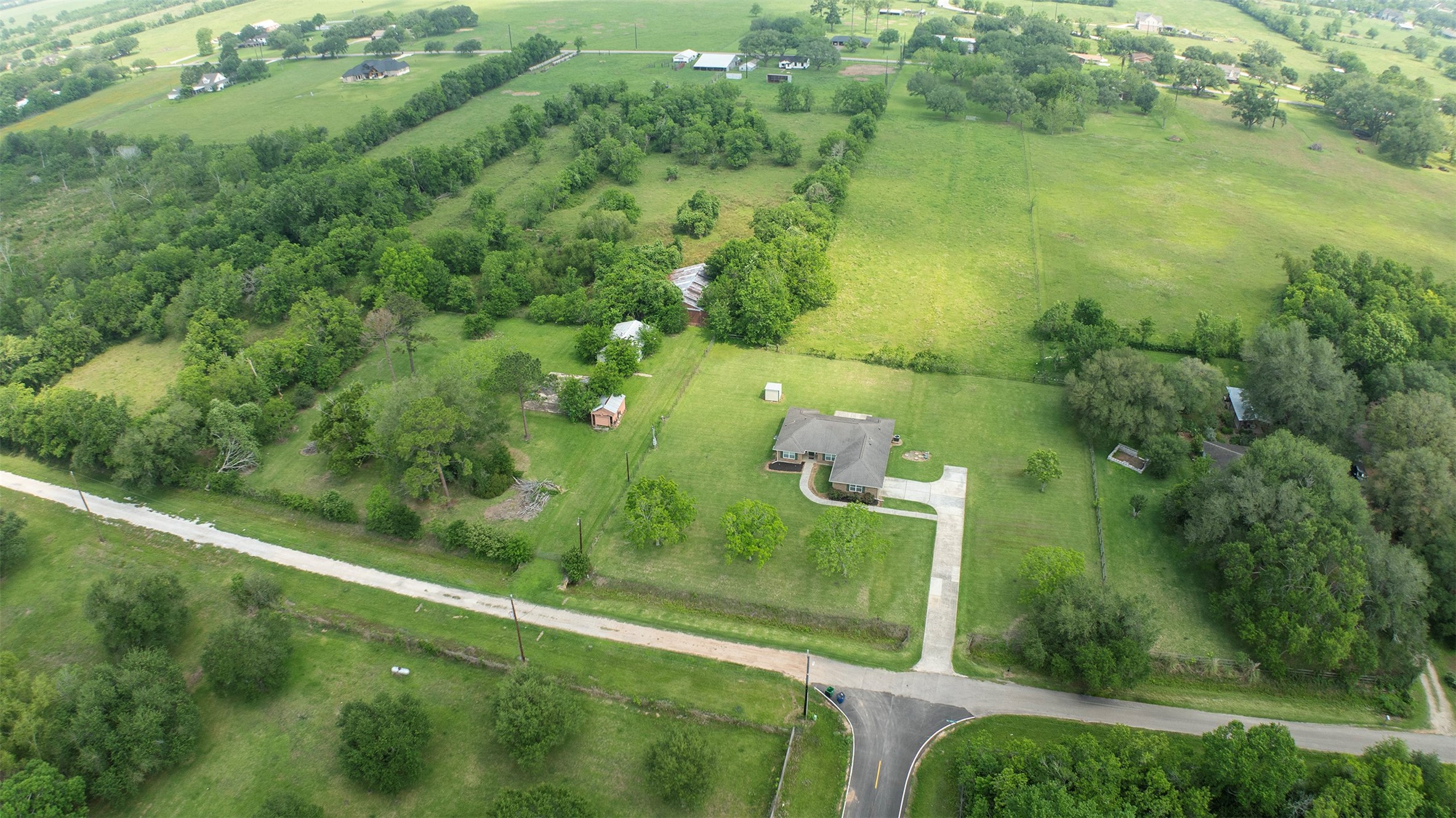 6105 Del Bello Boulevard Manvel, TX 77578 - Photo 2 of 37 a view of a green field with lots of bushes
