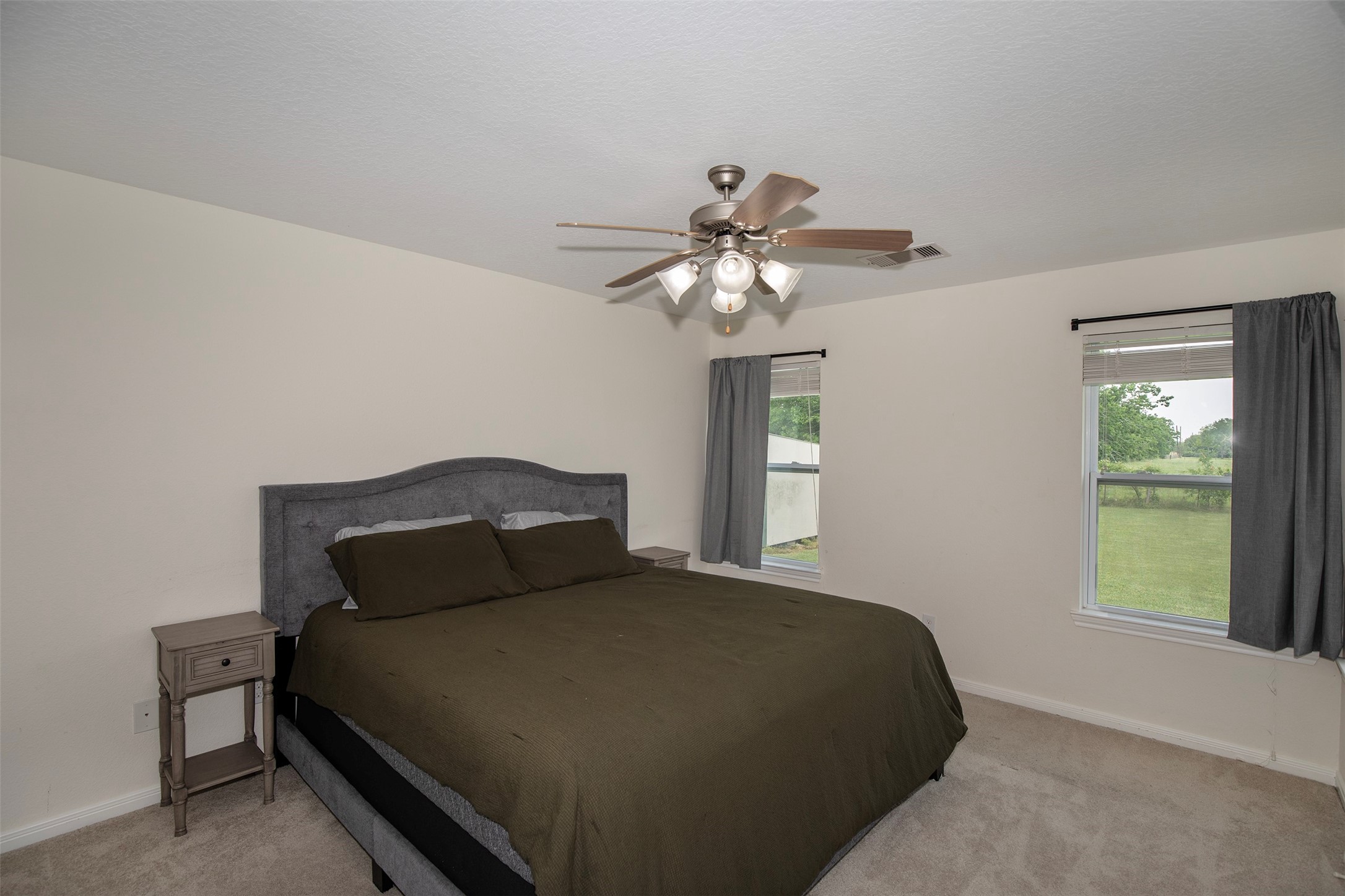 6105 Del Bello Boulevard Manvel, TX 77578 - Photo 22 of 37 a bedroom with a bed and window