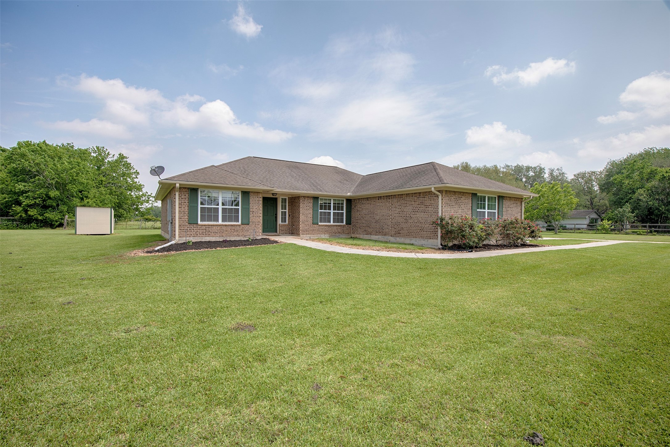 6105 Del Bello Boulevard Manvel, TX 77578 - Photo 3 of 37 a front view of a house with a yard table and chairs
