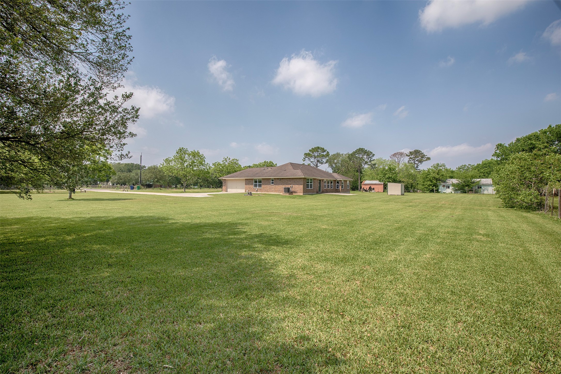 6105 Del Bello Boulevard Manvel, TX 77578 - Photo 32 of 37 a view of a green field with trees in the background