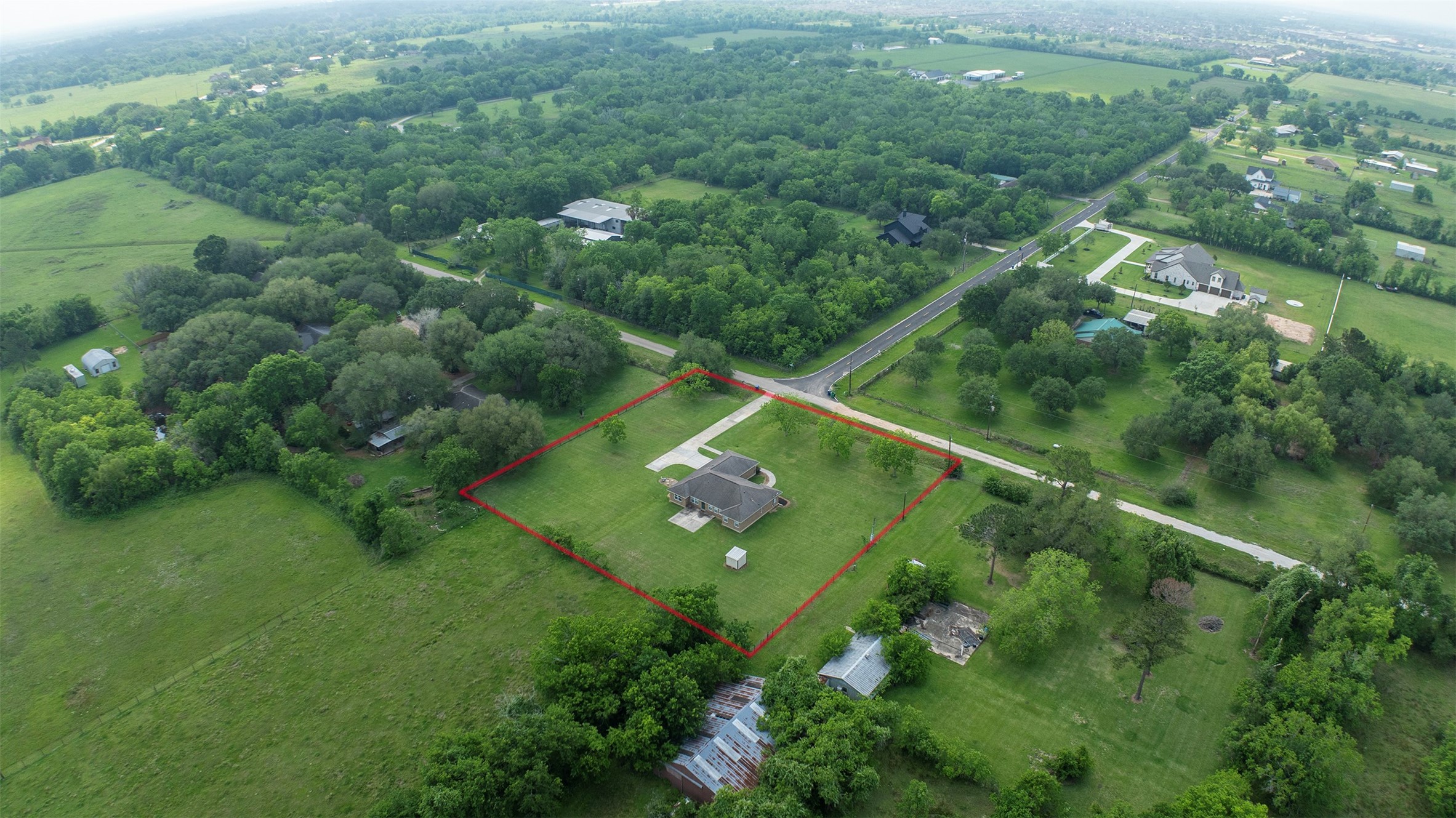 6105 Del Bello Boulevard Manvel, TX 77578 - Photo 35 of 37 an aerial view of residential houses with outdoor space and trees