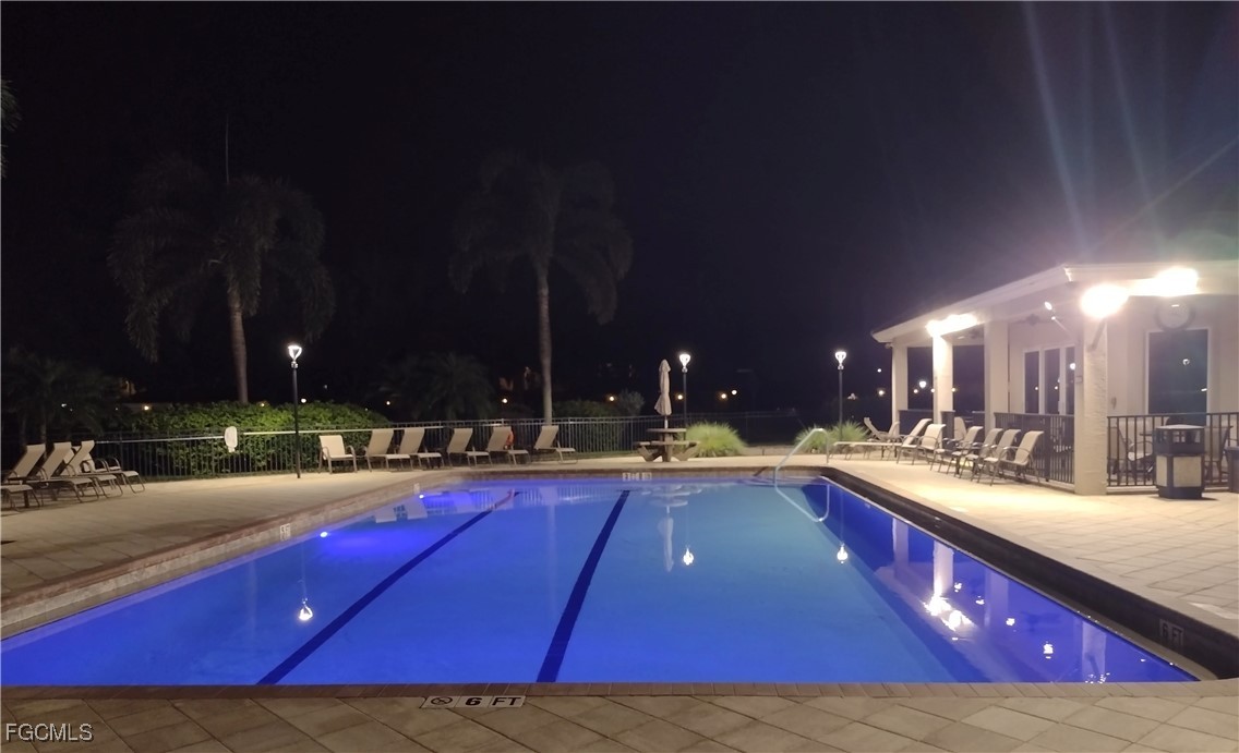 4709 Fairloop Run Lehigh Acres, FL 33973 - Photo 14 of 25 a view of swimming pool with outdoor seating