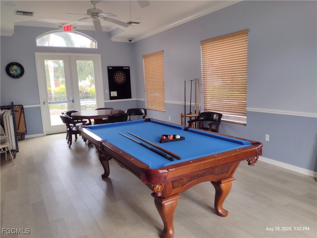 4709 Fairloop Run Lehigh Acres, FL 33973 - Photo 17 of 25 a room with pool table and windows