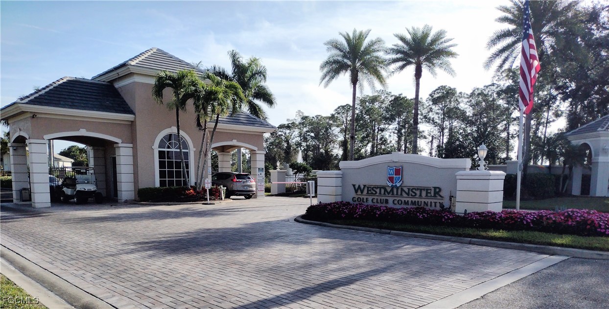 4709 Fairloop Run Lehigh Acres, FL 33973 - Photo 19 of 25 a front view of a house with garden and trees