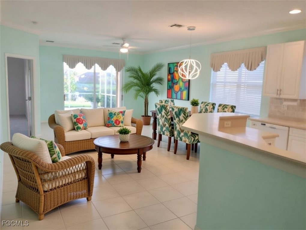 4709 Fairloop Run Lehigh Acres, FL 33973 - Photo 2 of 25 a living room with furniture and a large window