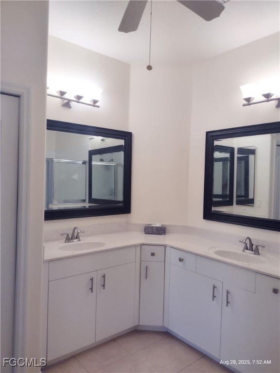 4709 Fairloop Run Lehigh Acres, FL 33973 - Photo 8 of 25 a bathroom with double sink and two mirror