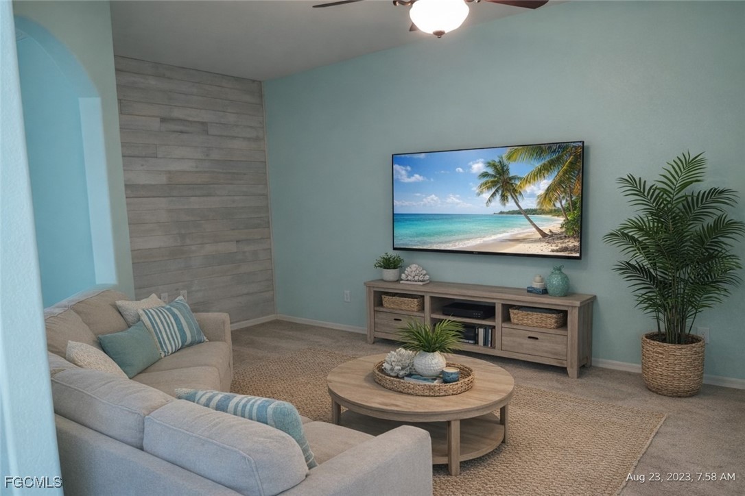 4709 Fairloop Run Lehigh Acres, FL 33973 - Photo 9 of 25 a living room with furniture and a potted plant