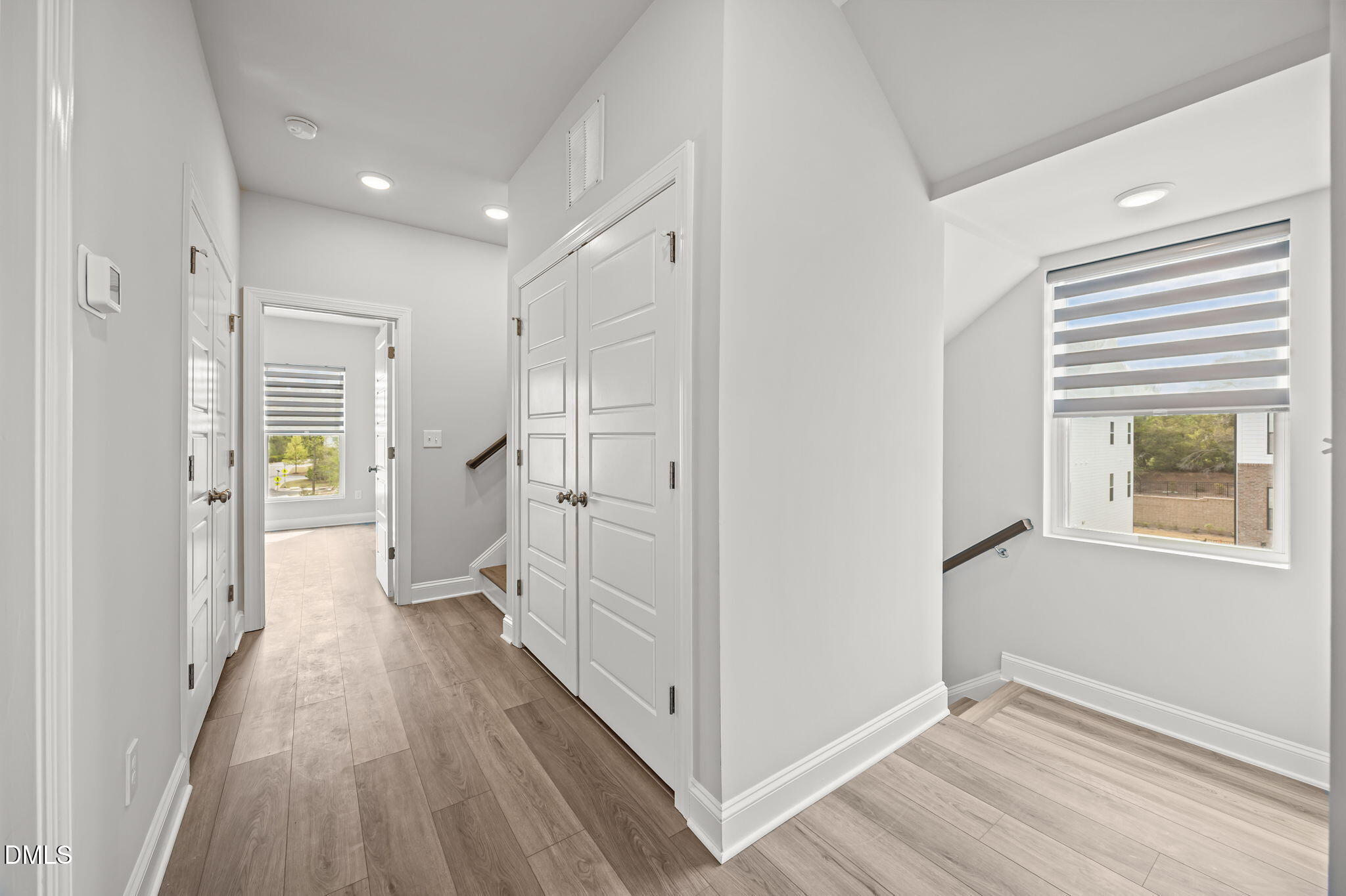 501 Hedrick Ridge Road Cary, NC 27519 - Photo 23 of 47 a view of hallway with walk in closet and wooden floor
