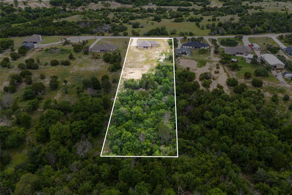 139 Kriston Lane Springtown, TX 76082 - Photo 33 of 39 Expansive parcel featuring a mix of cleared land and mature tree coverage