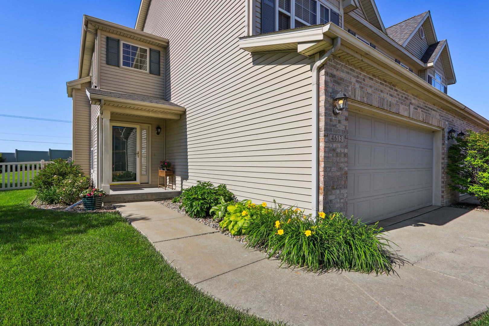 4613 Copper Ridge Road Champaign, IL 61822 - Photo 1 of 36 a view of a house with a small yard and plants