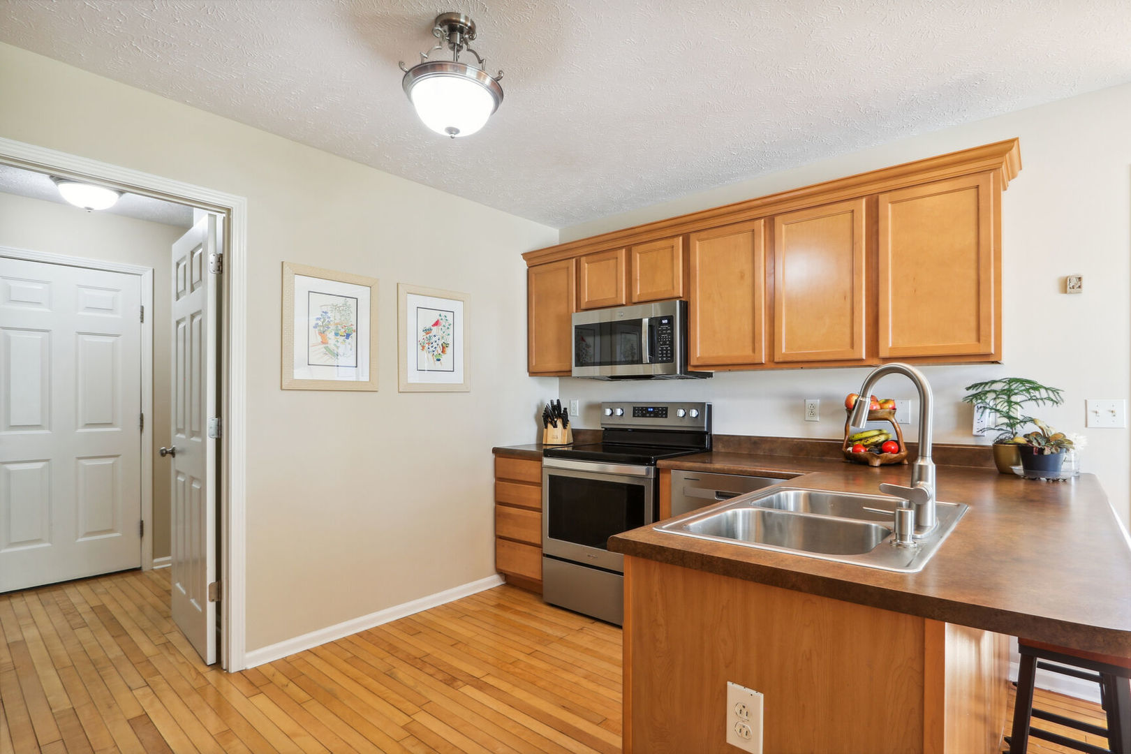 4613 Copper Ridge Road Champaign, IL 61822 - Photo 8 of 36 a kitchen with stainless steel appliances granite countertop a sink microwave and stove