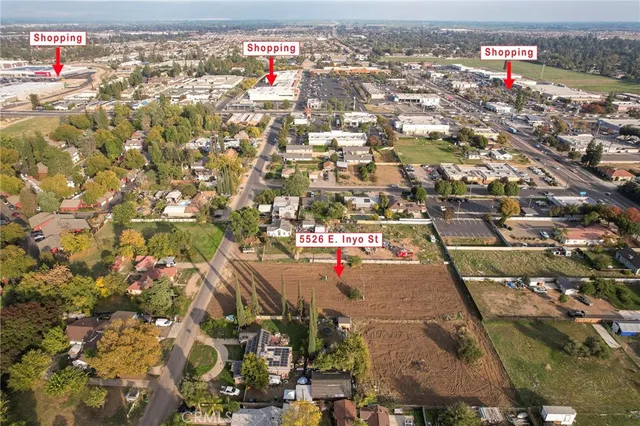 an aerial view of residential houses with city view