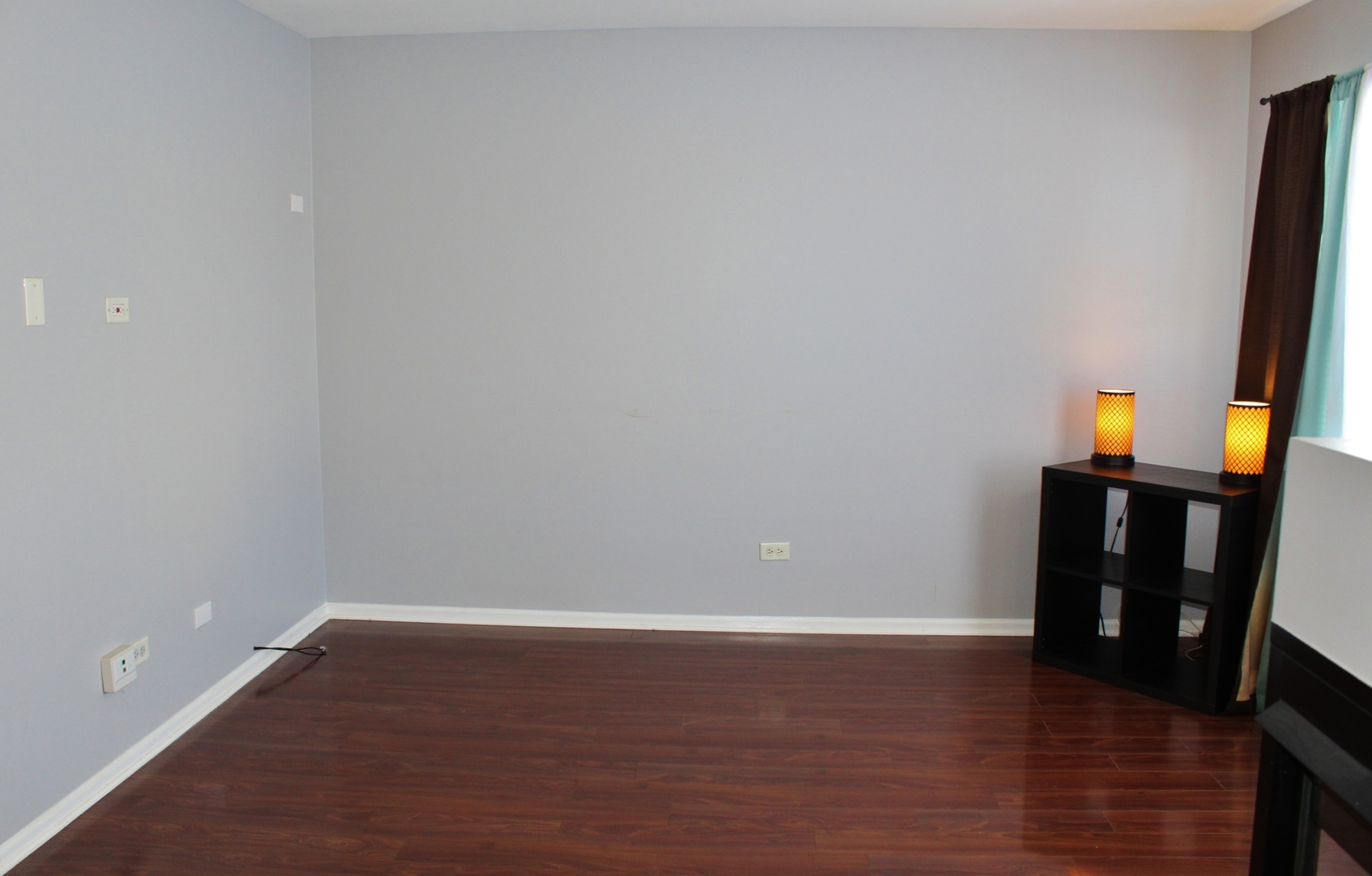 651 Chestnut Ridge Minooka, IL 60447 - Photo 14 of 33 a view of an empty room with wooden floor and a window
