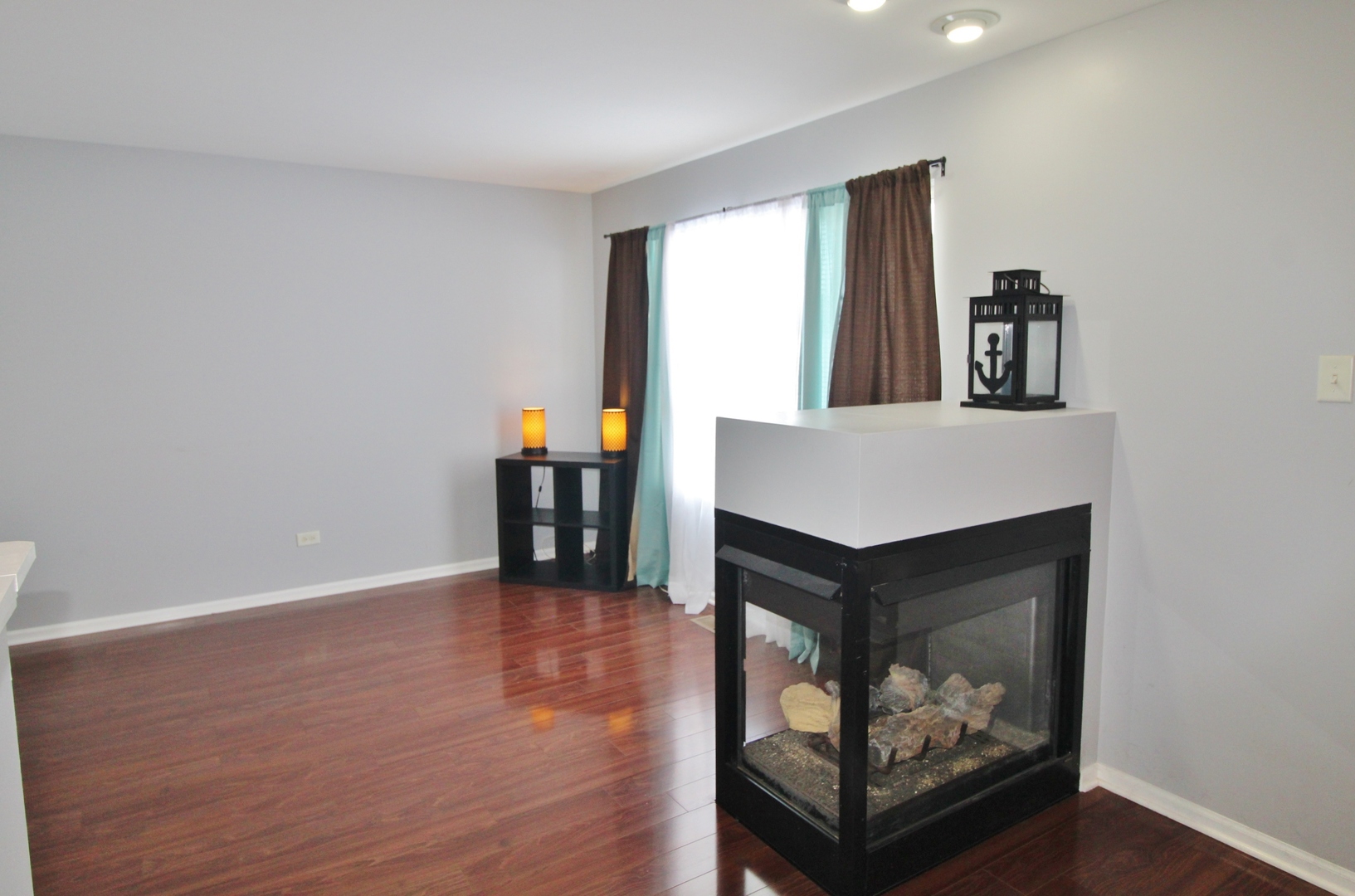 651 Chestnut Ridge Minooka, IL 60447 - Photo 16 of 33 a living room with hard wood floors and a fireplace