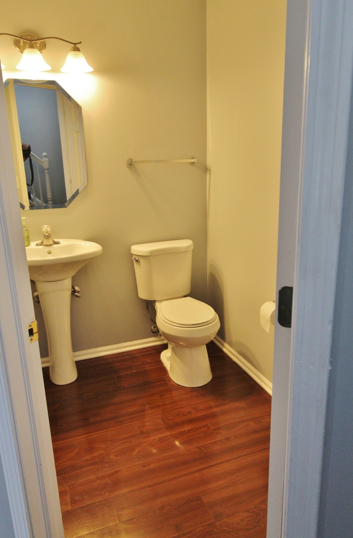 651 Chestnut Ridge Minooka, IL 60447 - Photo 28 of 33 a bathroom with a sink and a toilet