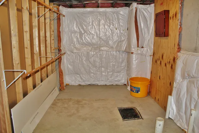 a view of a chairs with two potted plants
