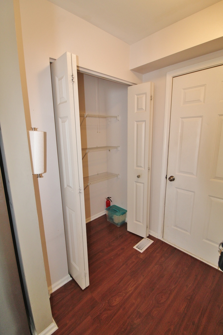 651 Chestnut Ridge Minooka, IL 60447 - Photo 8 of 33 an empty room with wooden floor and entrance