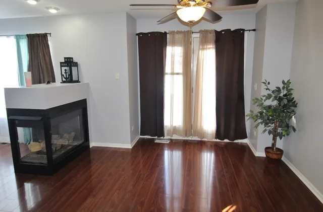 a view of livingroom with window and hardwood floor