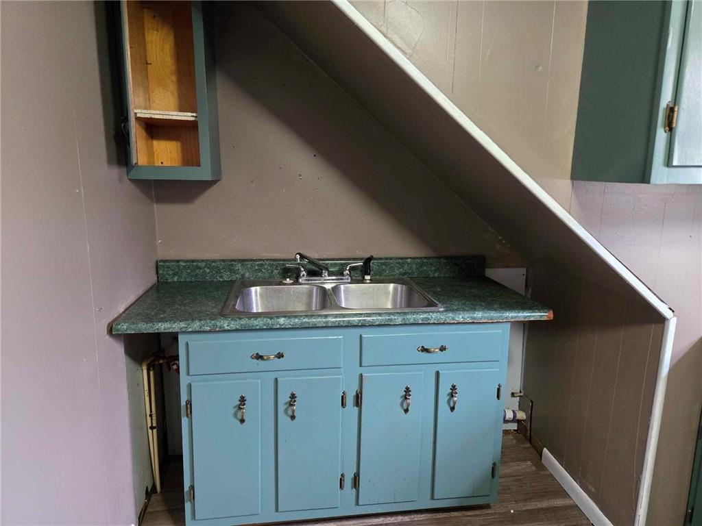 104 Forrest Street Petrolia, PA 16050 - Photo 17 of 22 a kitchen with a cabinets and chandelier