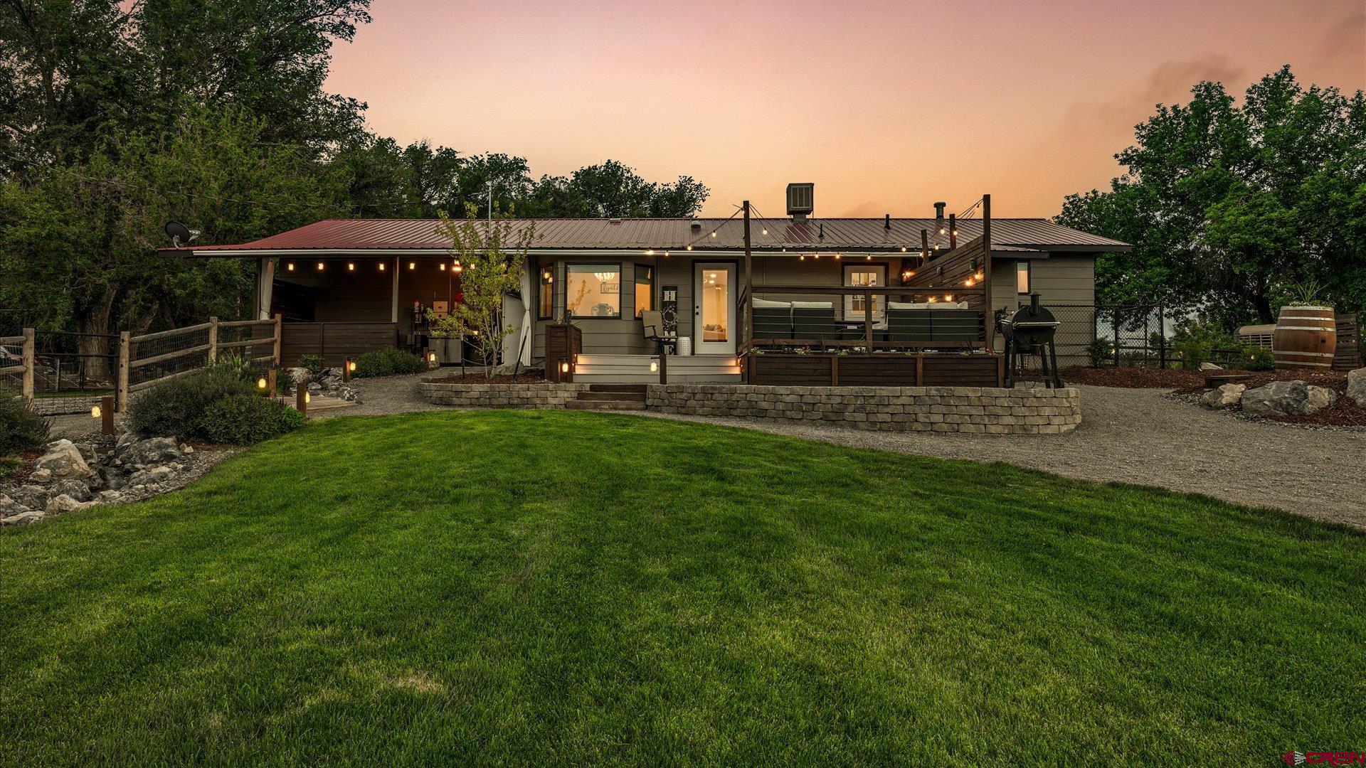 1761 G Road Delta, CO 81416 - Photo 25 of 43 a view of a house with backyard and sitting area