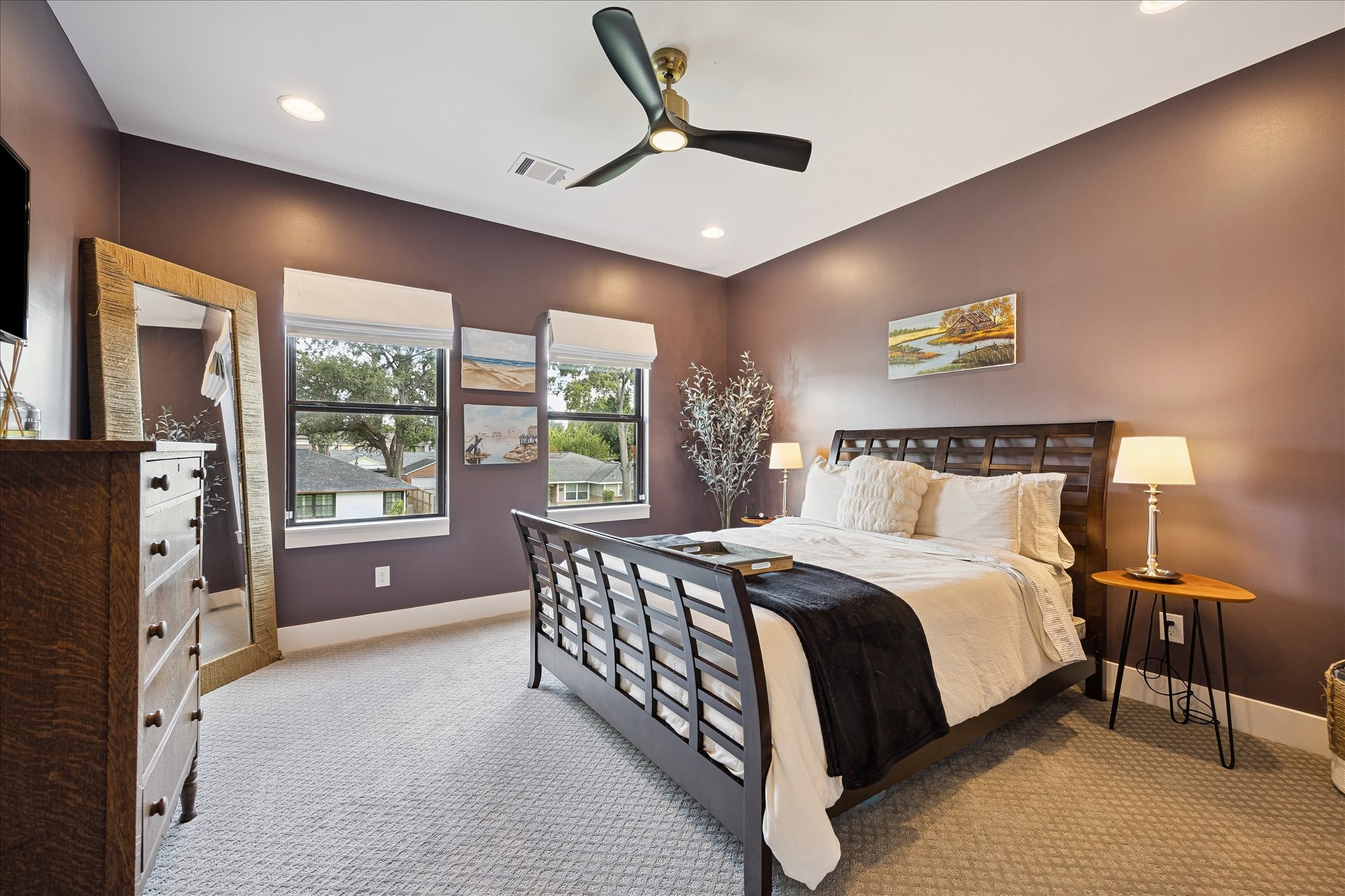 1313 Thornton Road Houston, TX 77018 - Photo 24 of 32 This spacious secondary bedroom offers abundant natural light, designer finishes, and generous proportions, creating a comfortable retreat for family or guests.