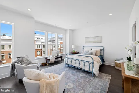 a spacious bathroom with a double vanity sink and a mirror