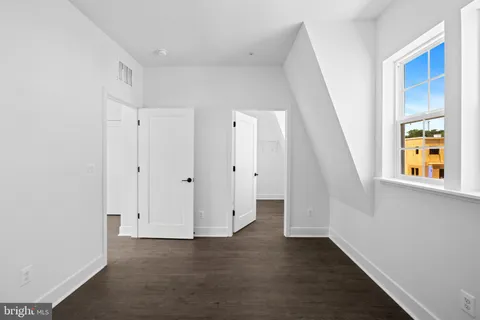 a view of a patio with couches chairs and a potted plant