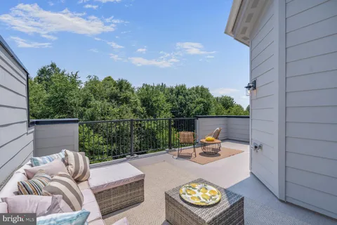 a bedroom with a bed and a chair