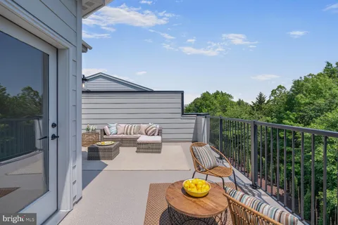 a spacious bedroom with a bed and a couch