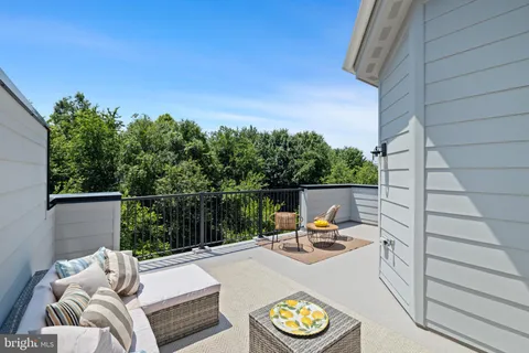 a bathroom with a sink a toilet and shower curtain