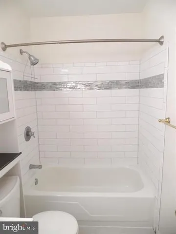 a bathroom with a shower and a bathtub