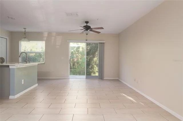 a view of a kitchen with furniture and windows