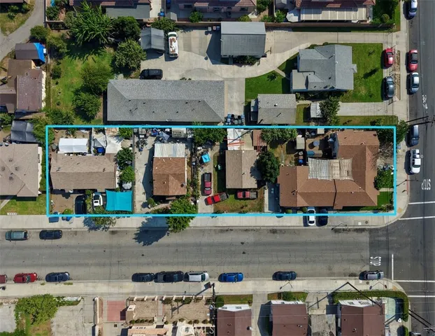 an aerial view of houses with outdoor space
