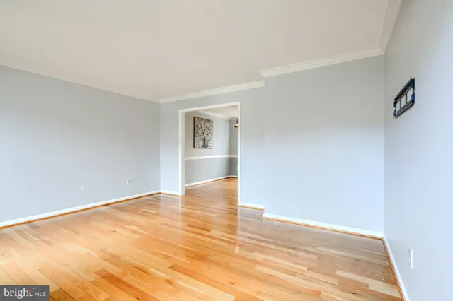 a kitchen with stainless steel appliances granite countertop a sink a stove and a wooden cabinets