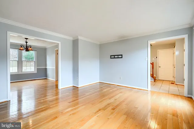 a large kitchen with granite countertop a stove top oven sink and cabinets