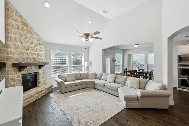 a living room with furniture and a fireplace