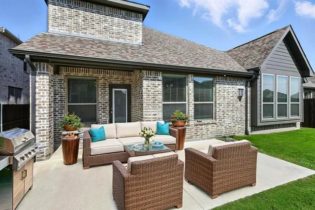 a front view of a house with yard and green space