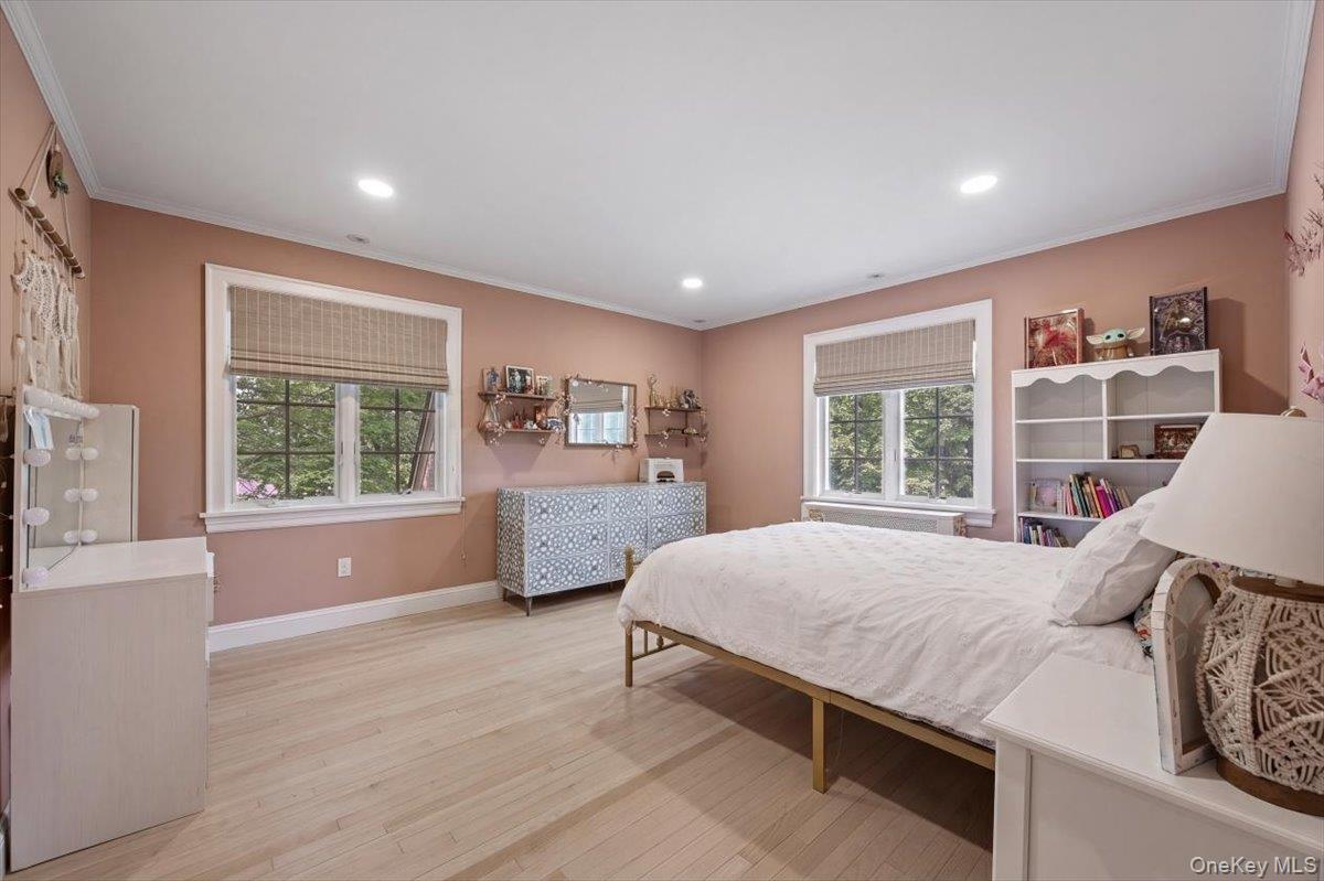 311 Lyncroft Road New Rochelle, NY 10804 - Photo 19 of 39 a bedroom with a large bed and a window