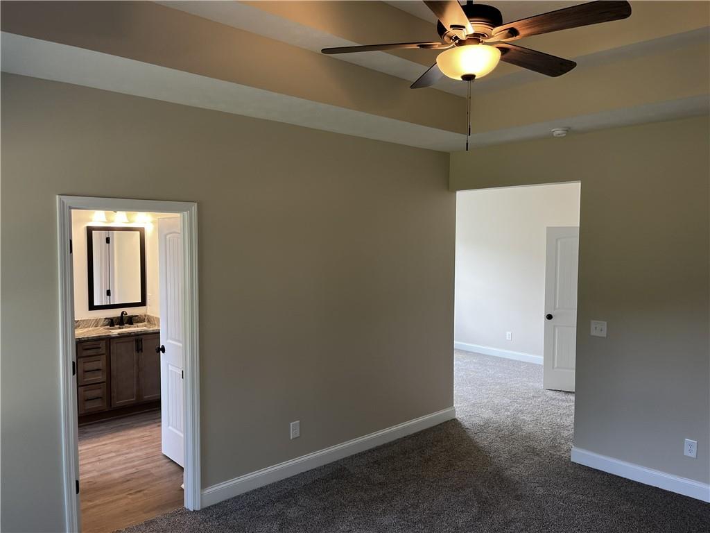 1932 Cochran Ridge Road Hiram, GA 30141 - Photo 22 of 30 wooden floor in an empty room and a kitchen