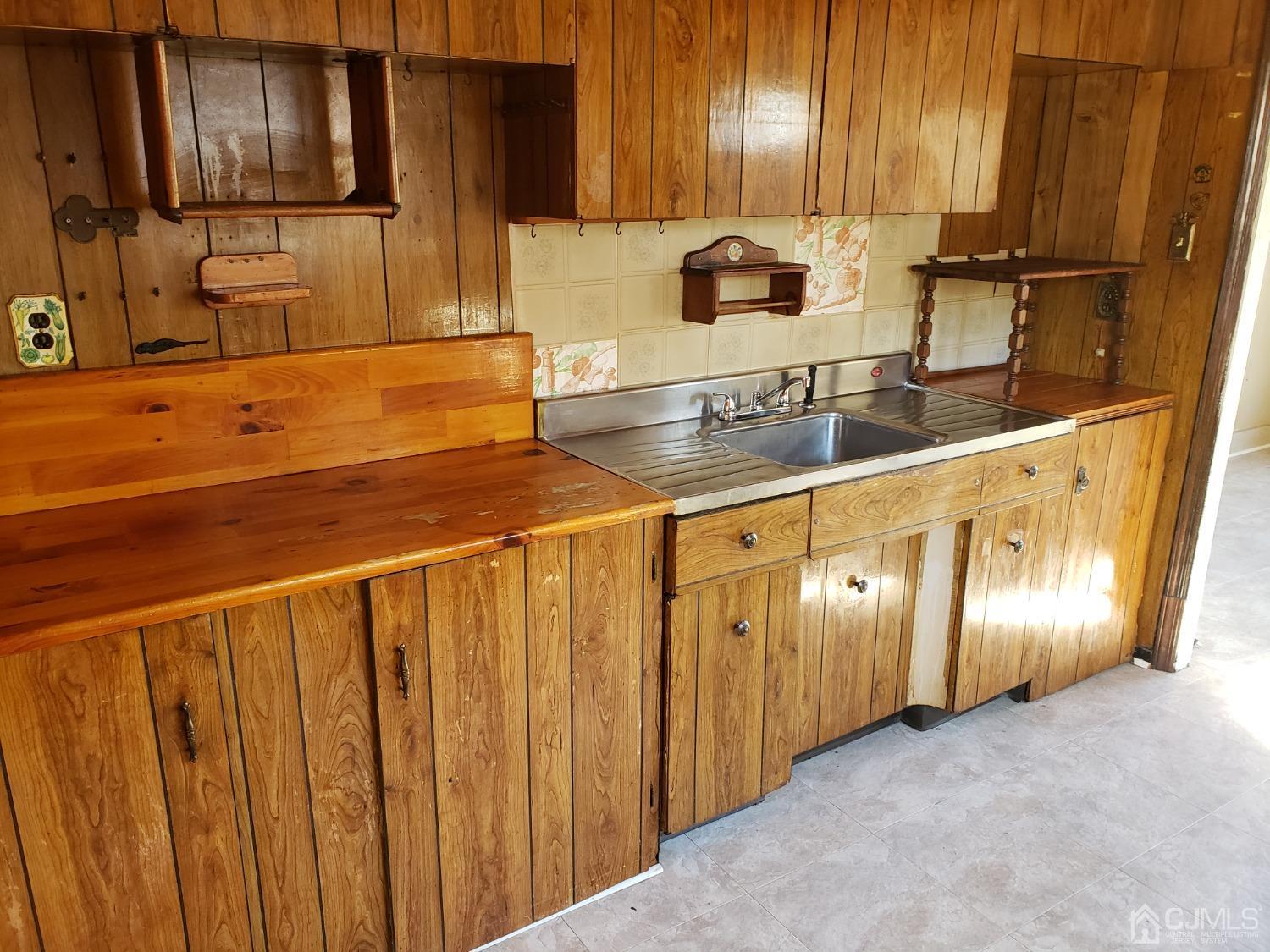 32 Crescent Road Edison, NJ 08817 - Photo 11 of 18 a kitchen with stainless steel appliances granite countertop a sink and cabinets