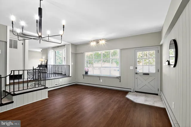 a kitchen with stainless steel appliances a refrigerator sink and cabinets