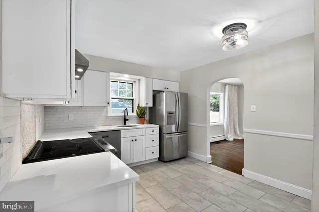 a bathroom with a bath tub with a shower