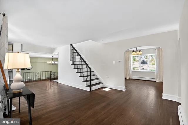 a view of an entryway with wooden floor