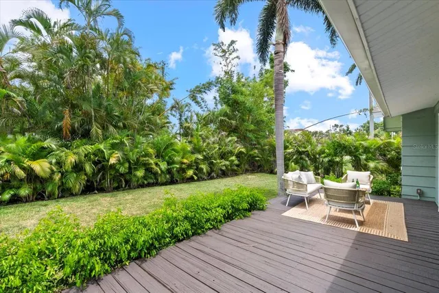 a view of backyard with seating space