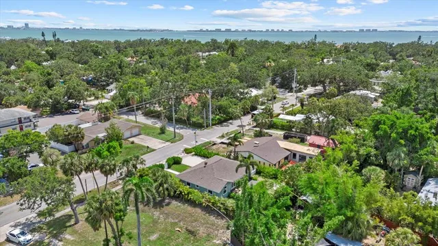 an aerial view of a house with a yard and garden