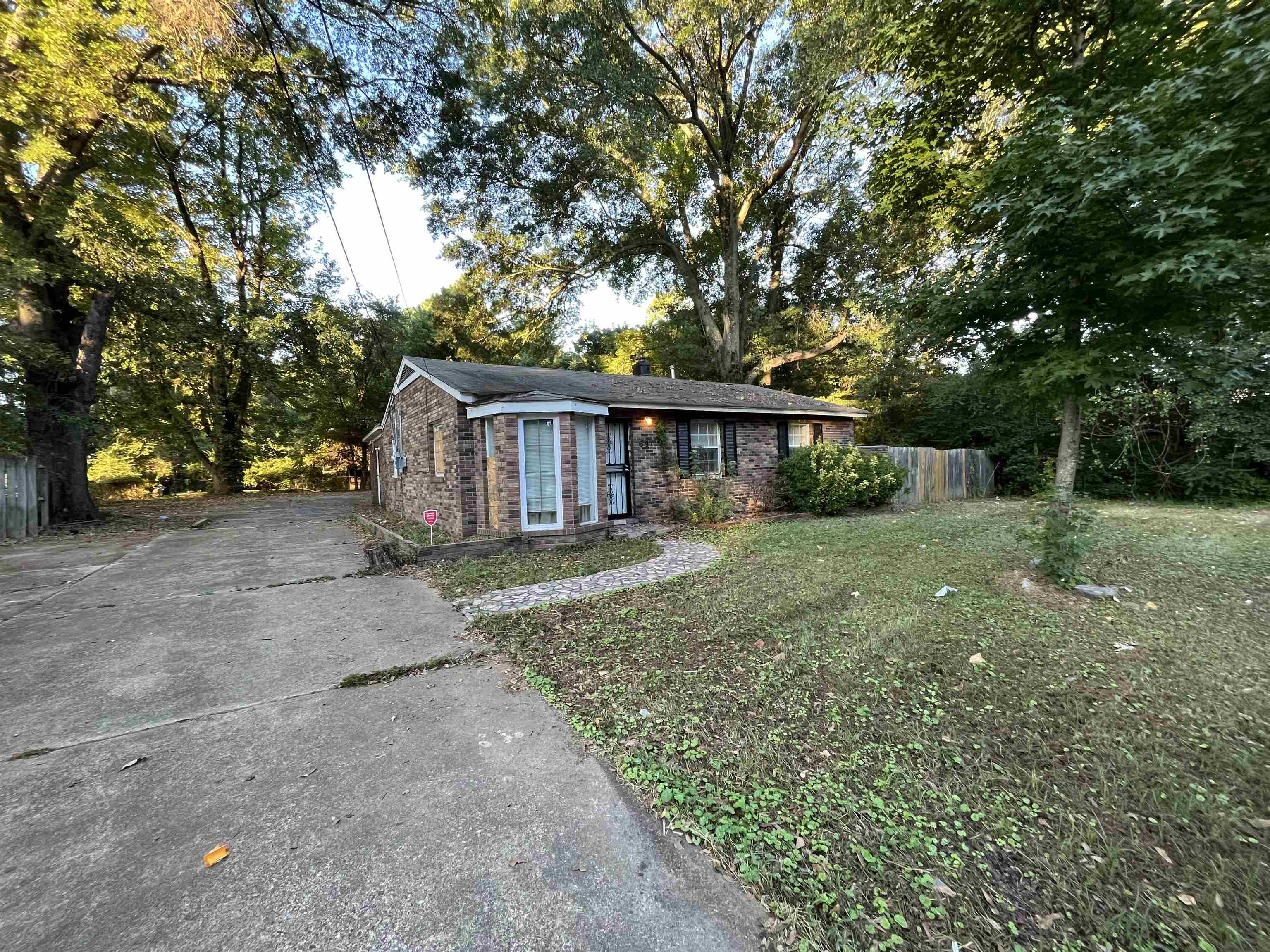 691 Delta Road Memphis, TN 38109 - Photo 1 of 25 a view of a house with backyard and a tree