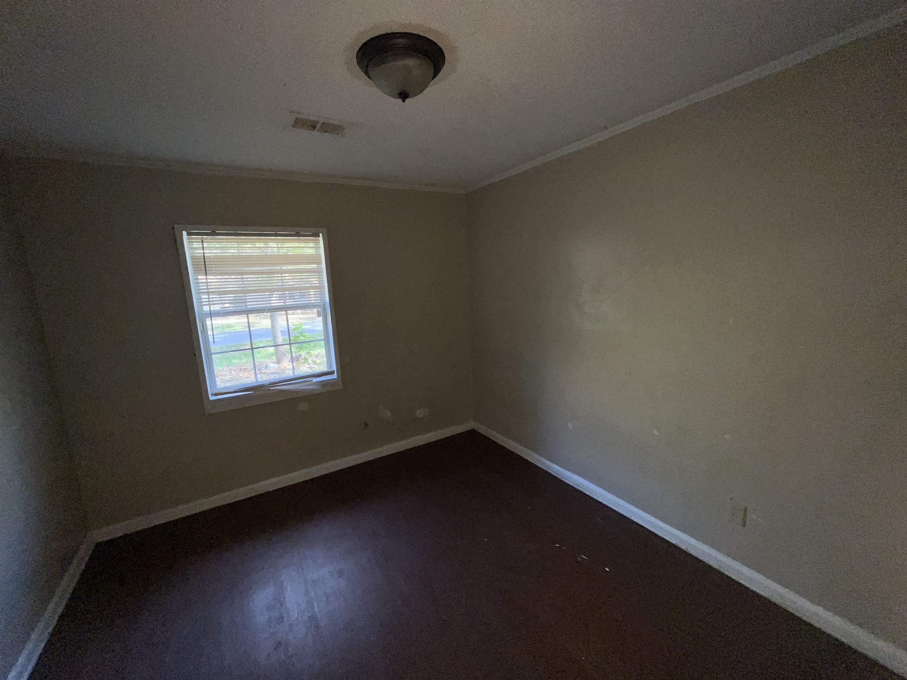 691 Delta Road Memphis, TN 38109 - Photo 20 of 25 an empty room with a window
