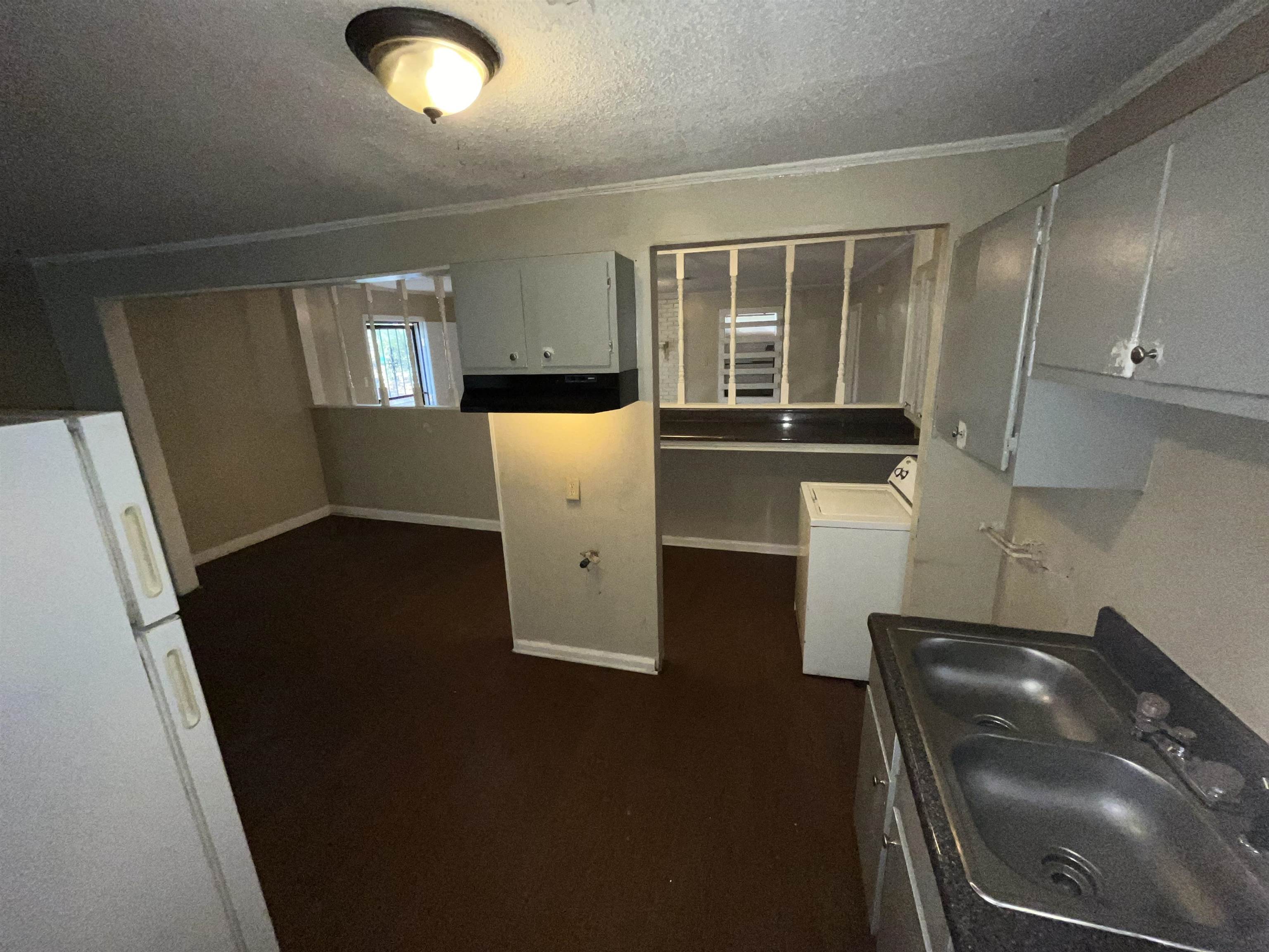 691 Delta Road Memphis, TN 38109 - Photo 25 of 25 wooden floor in an empty room with a window